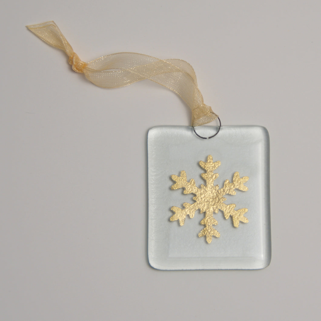 Gold snowflake hanging by Flow Glass Orkney Islands Scotland