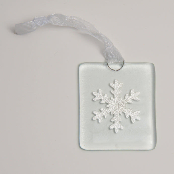 Silver snowflake hanging by Flow Glass Orkney Islands Scotland